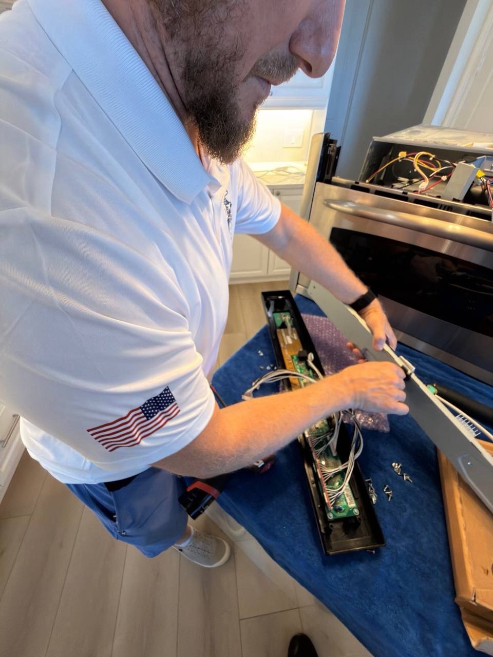 Oven repair in progress in a Naples home
