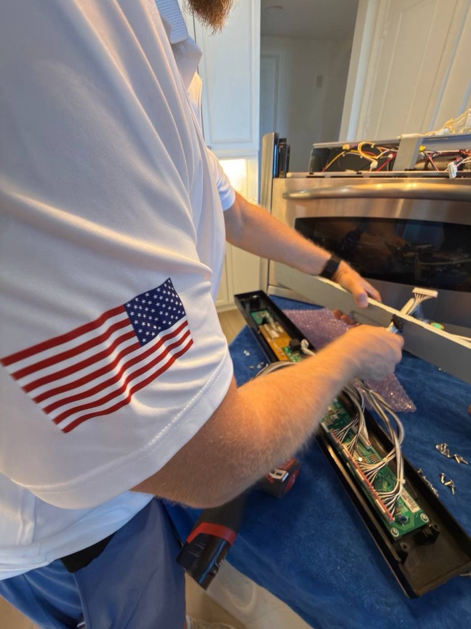 Oven repair in progress in a Naples home