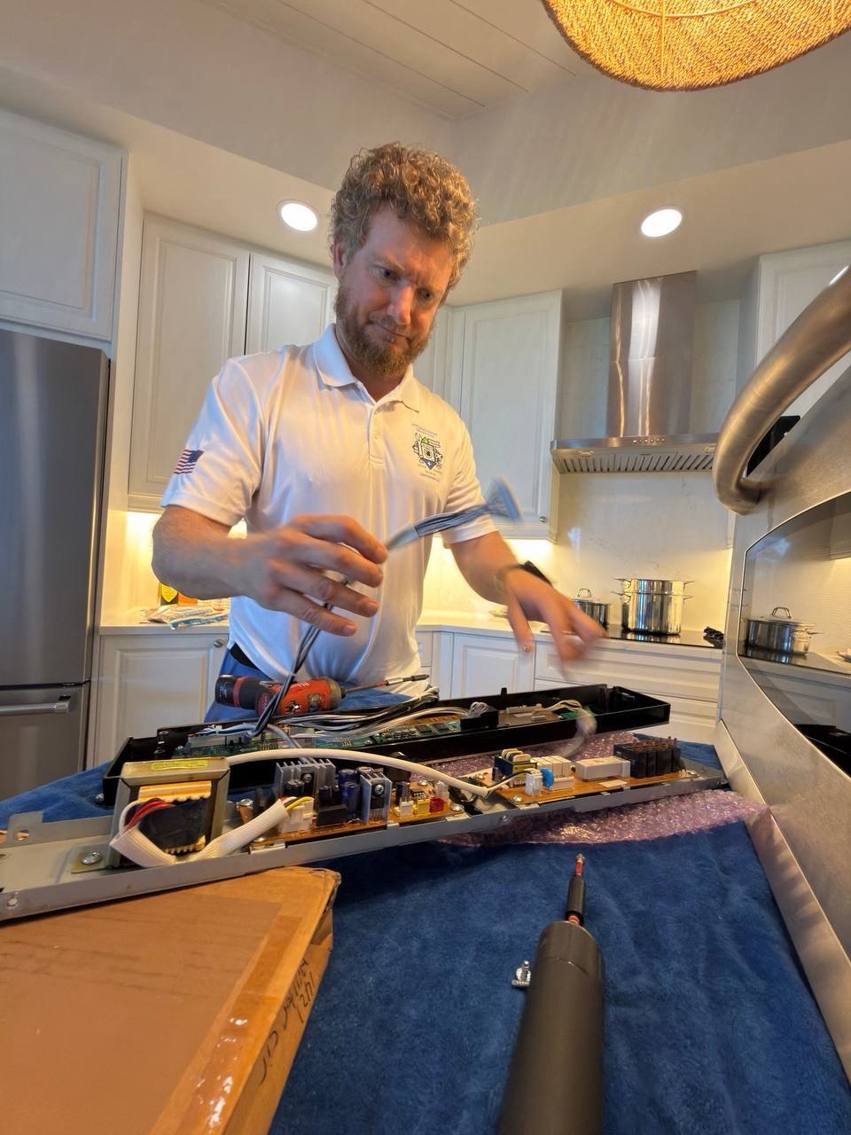 Oven repair in progress in a Naples home