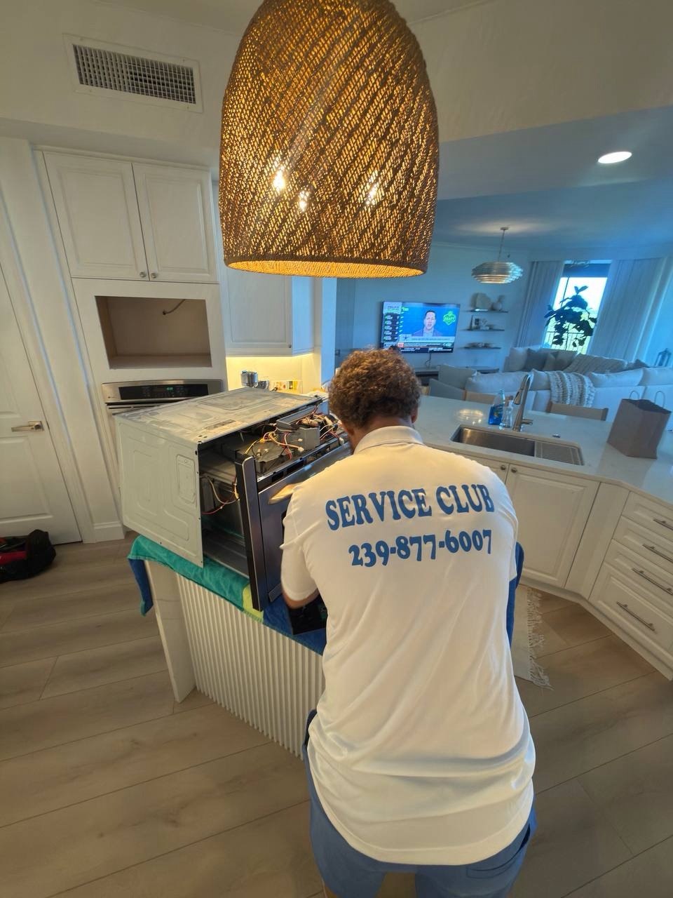 Oven repair in progress in a Naples home