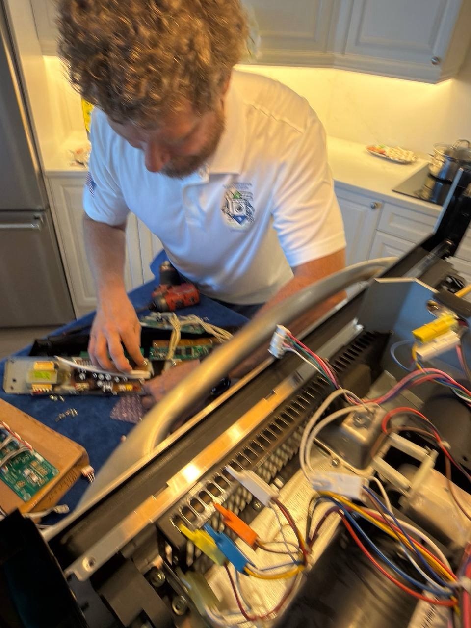Oven repair in progress in a Naples home