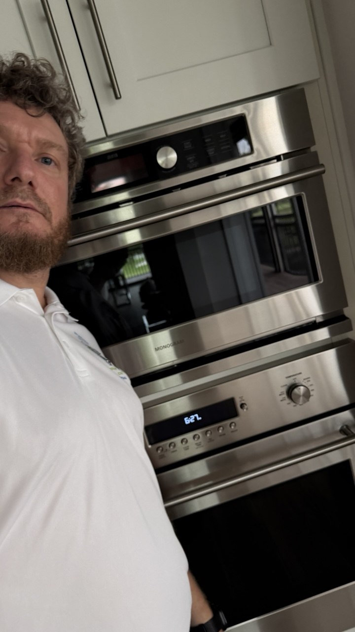 Oven repair in progress in a Naples home