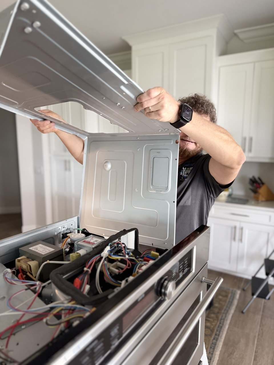 Oven repair in progress in a Naples home